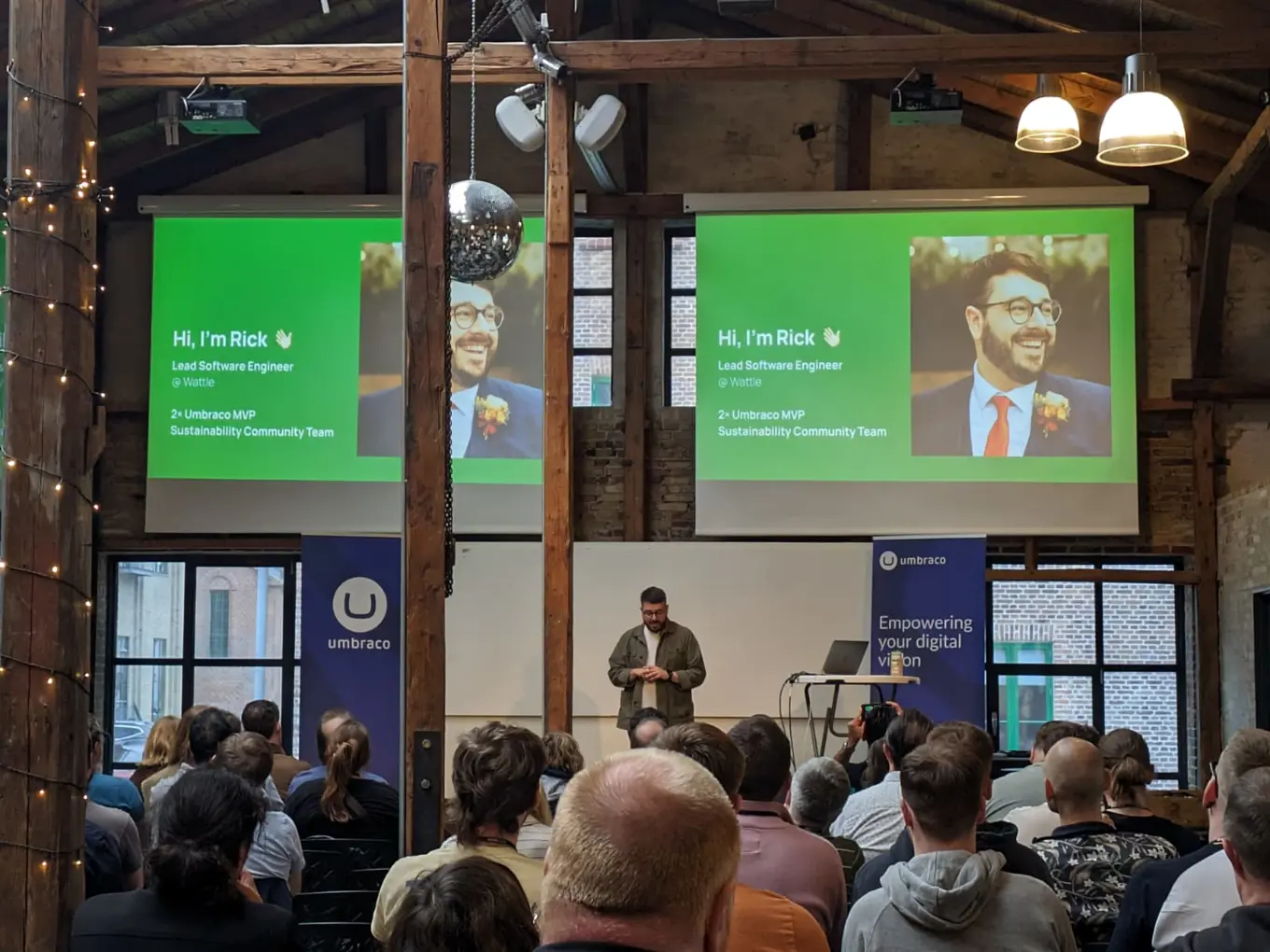 Rick Butterfield on stage, in front of an eager audience at Umbraco Codegarden, presenting his talk on "Green Code: A Blueprint for Eco-Friendly Websites".