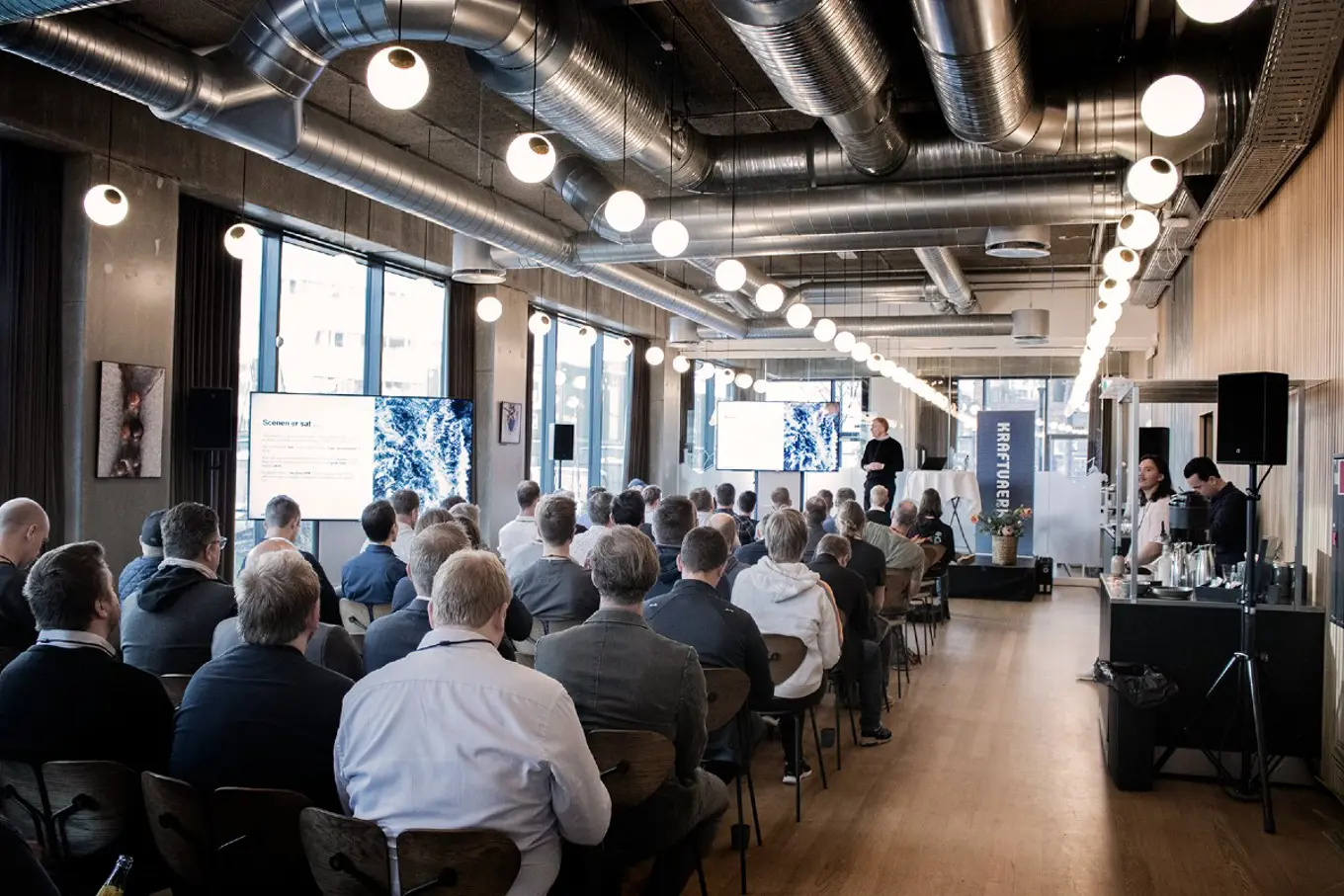 the back of people's heads in an audience for the Umbraco DK festival