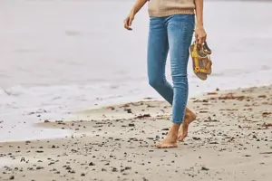 Person in bare feet at the beach