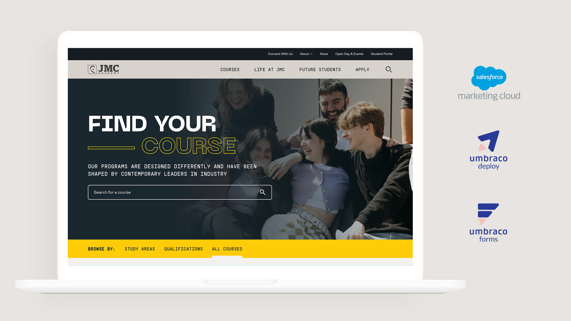 A laptop displaying the JMC Academy "Find Your Course" landing page banner, positioned alongside logos for Salesforce Marketing Cloud, Umbraco Deploy, and Umbraco Forms.