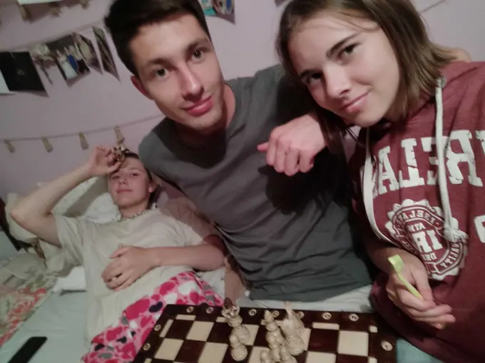 Krystof playing chess with friends