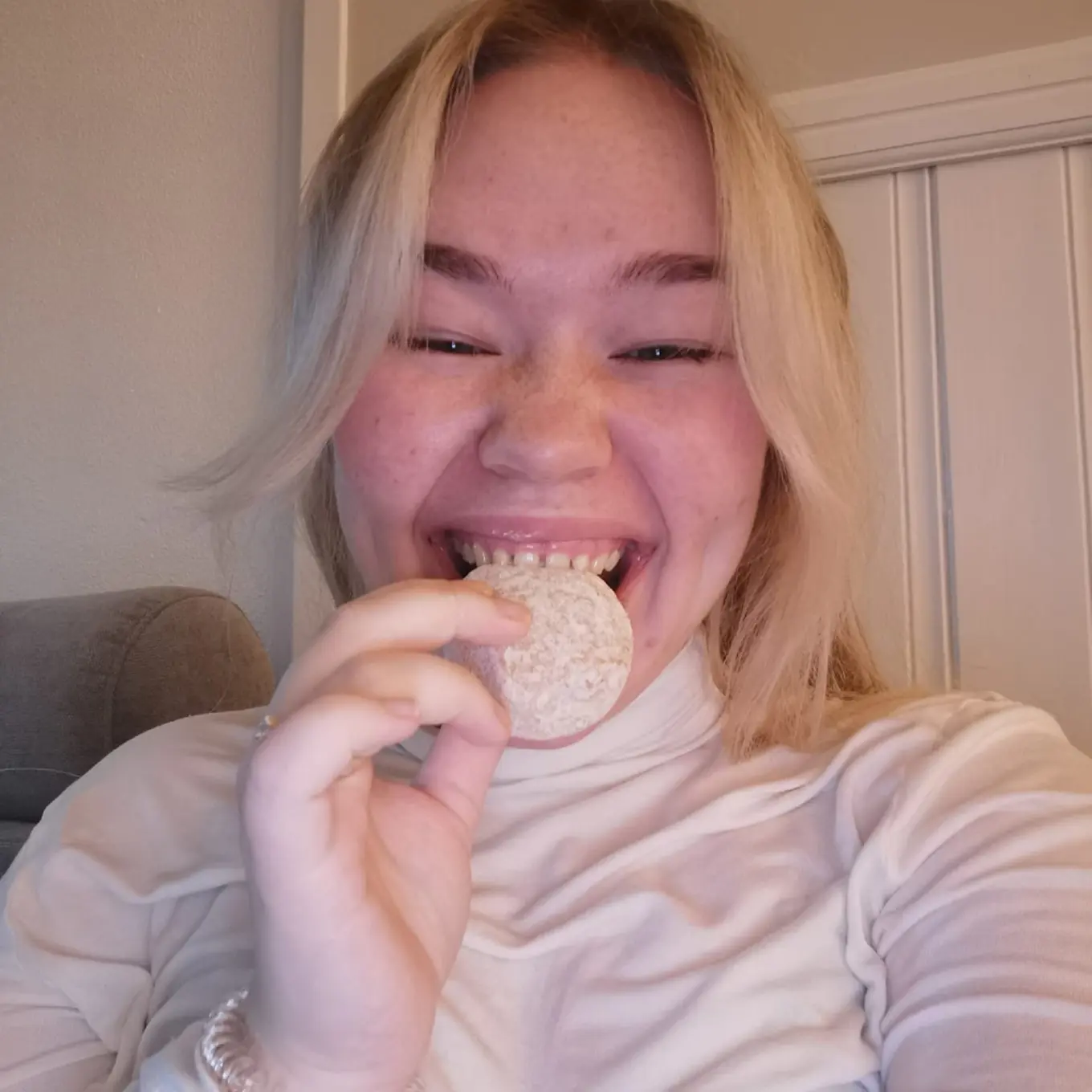 Bianca eating a berliner