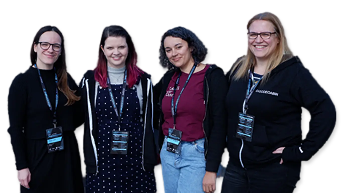 The four women of Candid Contributions standing and smiling