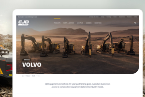 A wide composite image showing a yellow Volvo excavator working in a quarry alongside a laptop mockup displaying CJD Equipment's Volvo machinery showcase landing page.