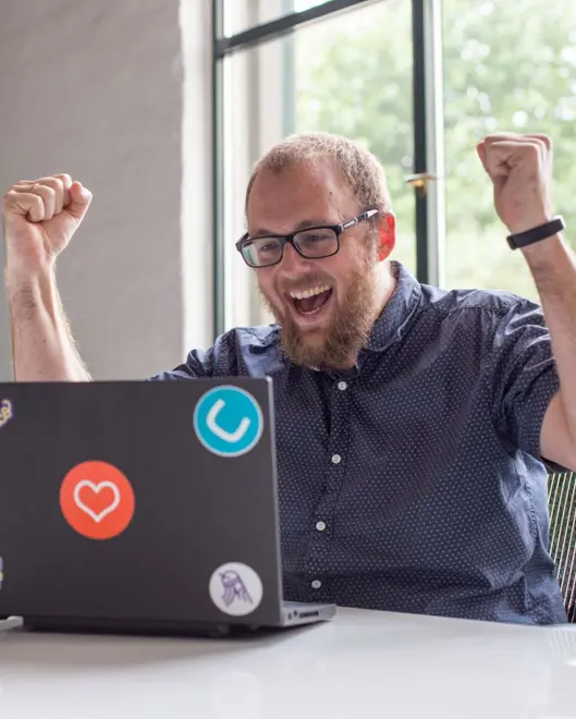 Happy editor with laptop