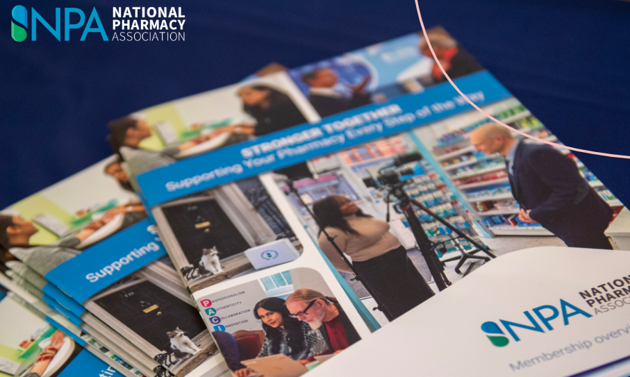 Brochures on a table with National Pharmacy Association logo, including a “Supporting …” cover.
