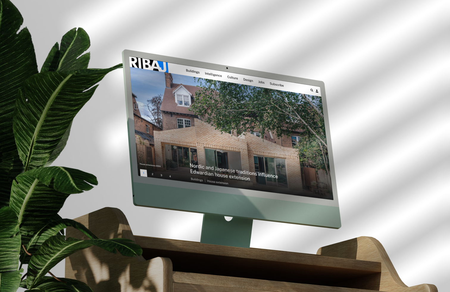 A desktop monitor displaying the RIBA Journal website featuring an article about an Edwardian house extension.