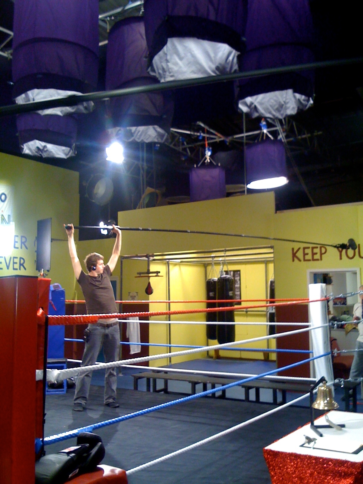 A man recording sound on a tv set