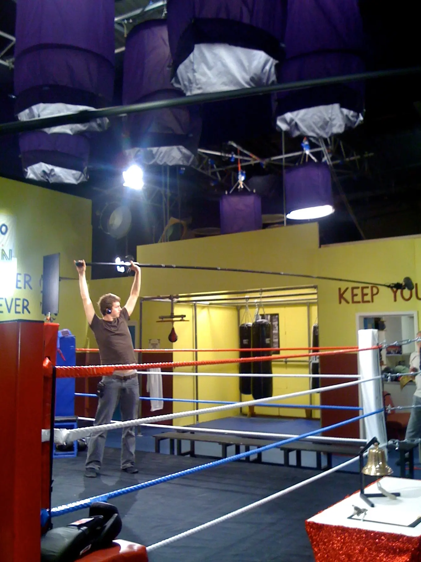 A man recording sound on a tv set