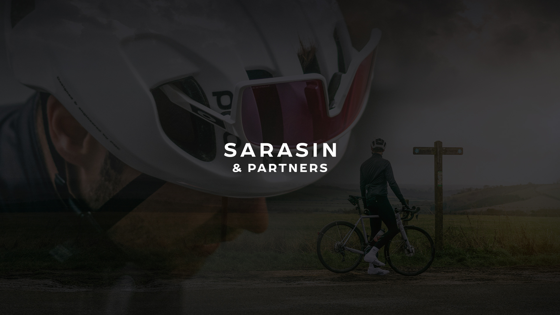 Sarasin & Partners logo in white over a dark, layered image of a cyclist in a helmet stopped by a signpost on a countryside road.