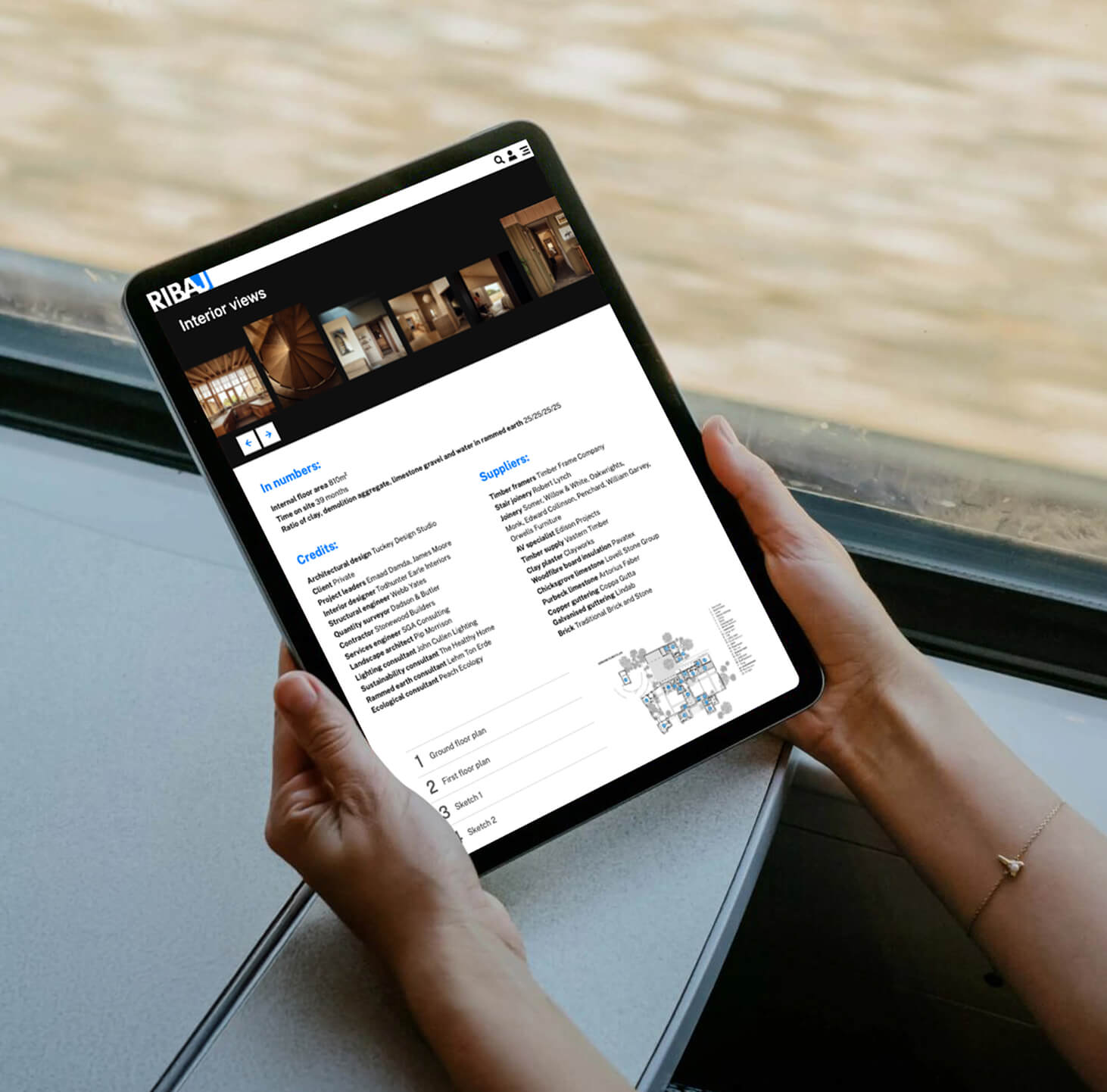 A tablet displaying technical project details, credits, and floor plans on the RIBA Journal website.