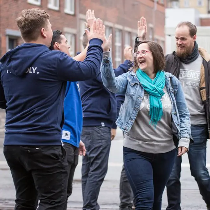 People highfiving at Codegarden