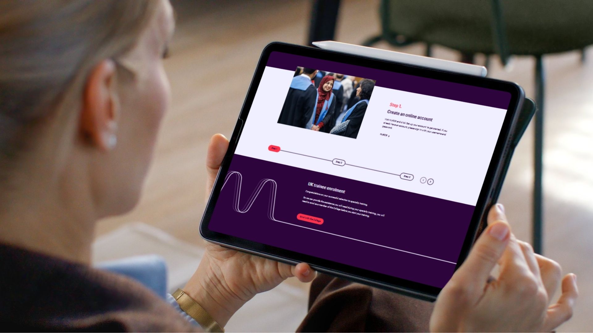 A person holding a tablet that displays the "UK trainee enrolment" page on the Royal College of Radiologists website, highlighting "Step 1: Create an online account."