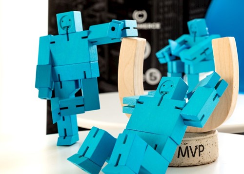 Small square wooden figures leaning towards Umbraco MVP award