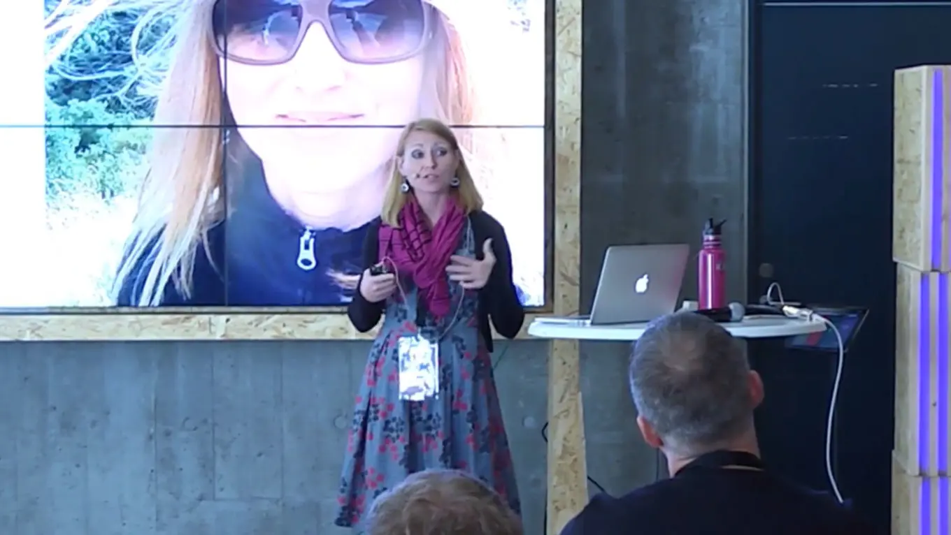 Erica Quessenberry, on stage, delivering a talk at Codegarden 2016, on Building an inclusive community: the ROI of gender diversity in tech.