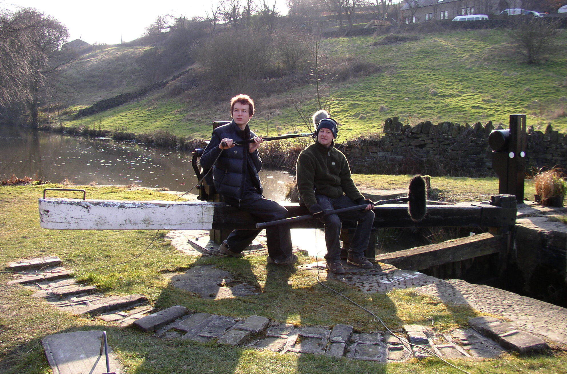 Two people recording sound in the English canals