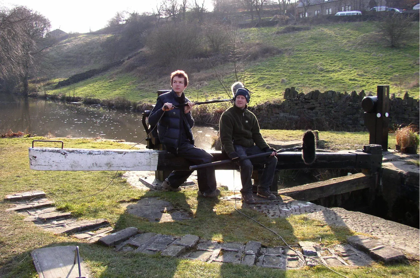 Two people recording sound in the English canals