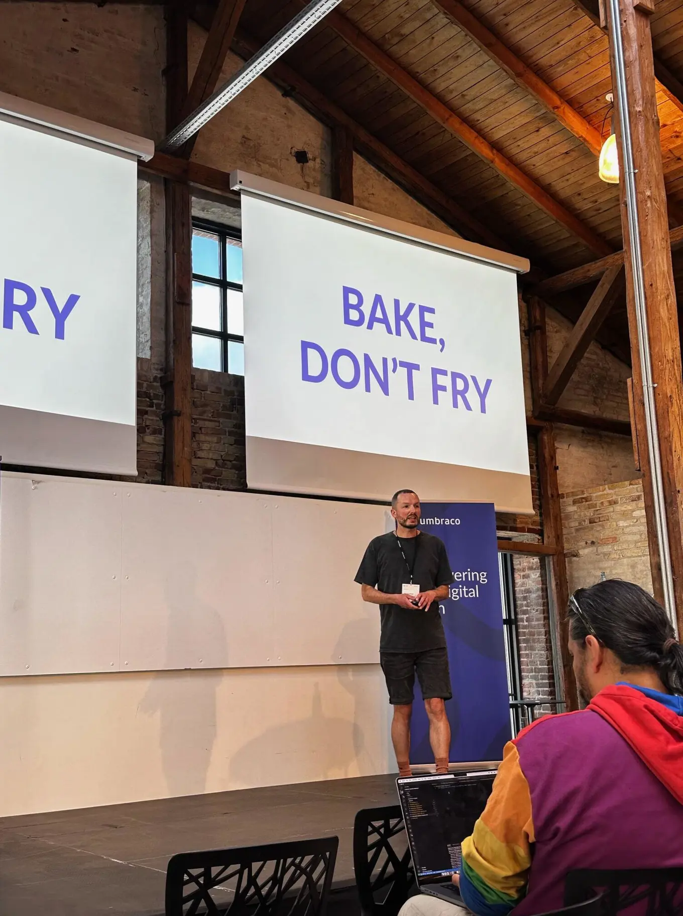 Adam Prendergast speaking on stage