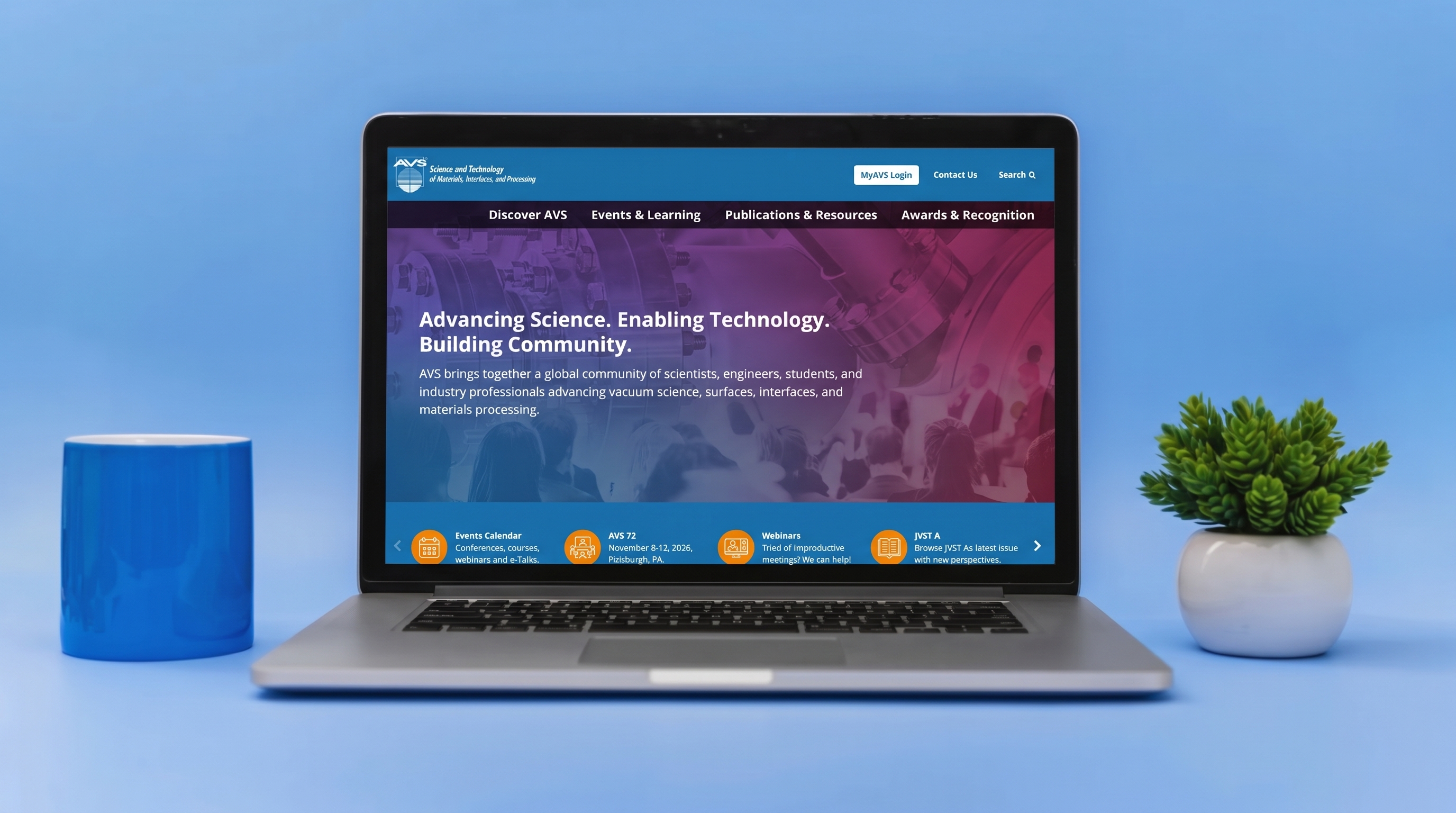 Laptop displaying AVS website with “Advancing Science. Enabling Technology. Building Community.”