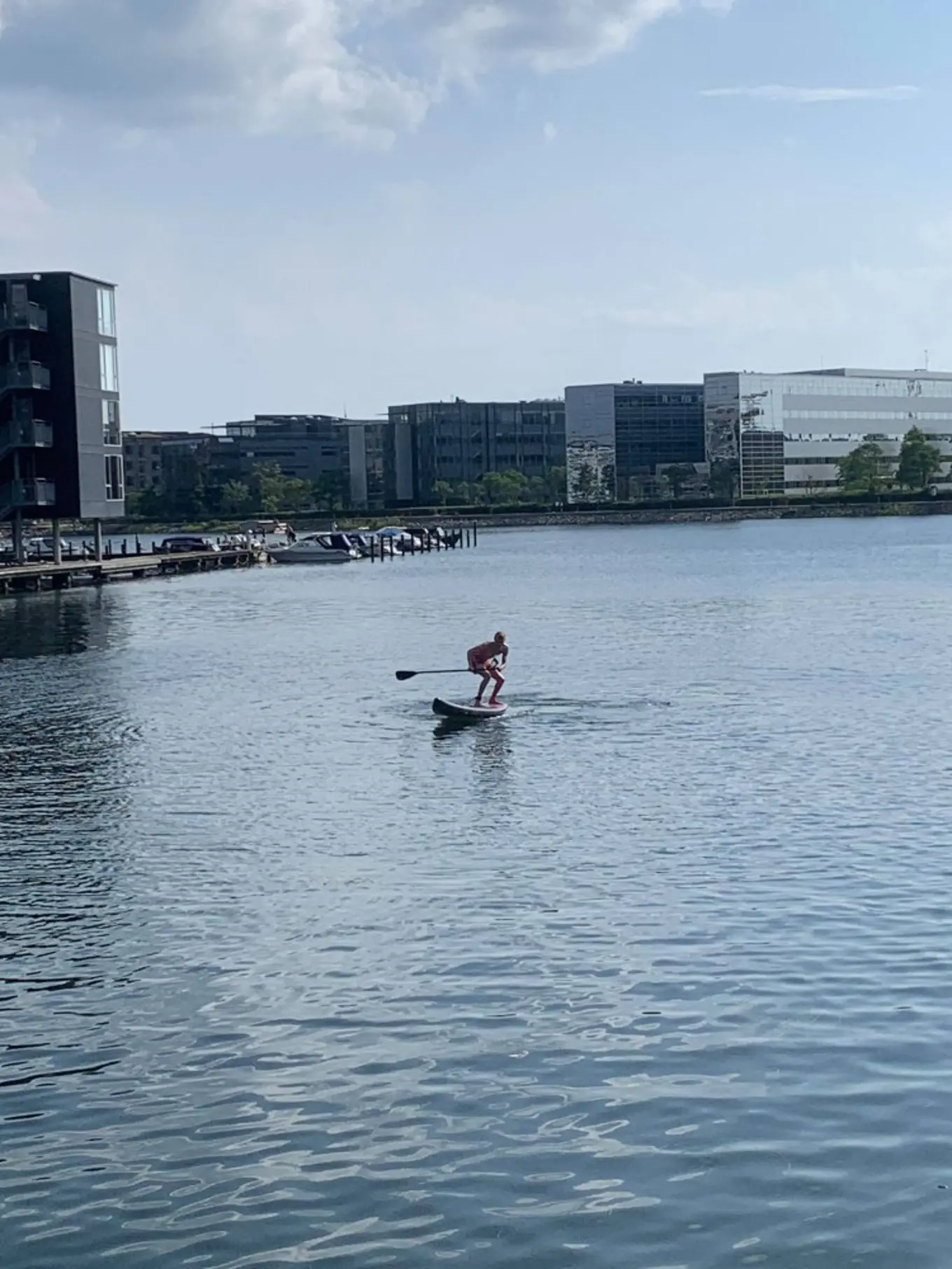 Aleksander on his SUP board right before falling in the harbor