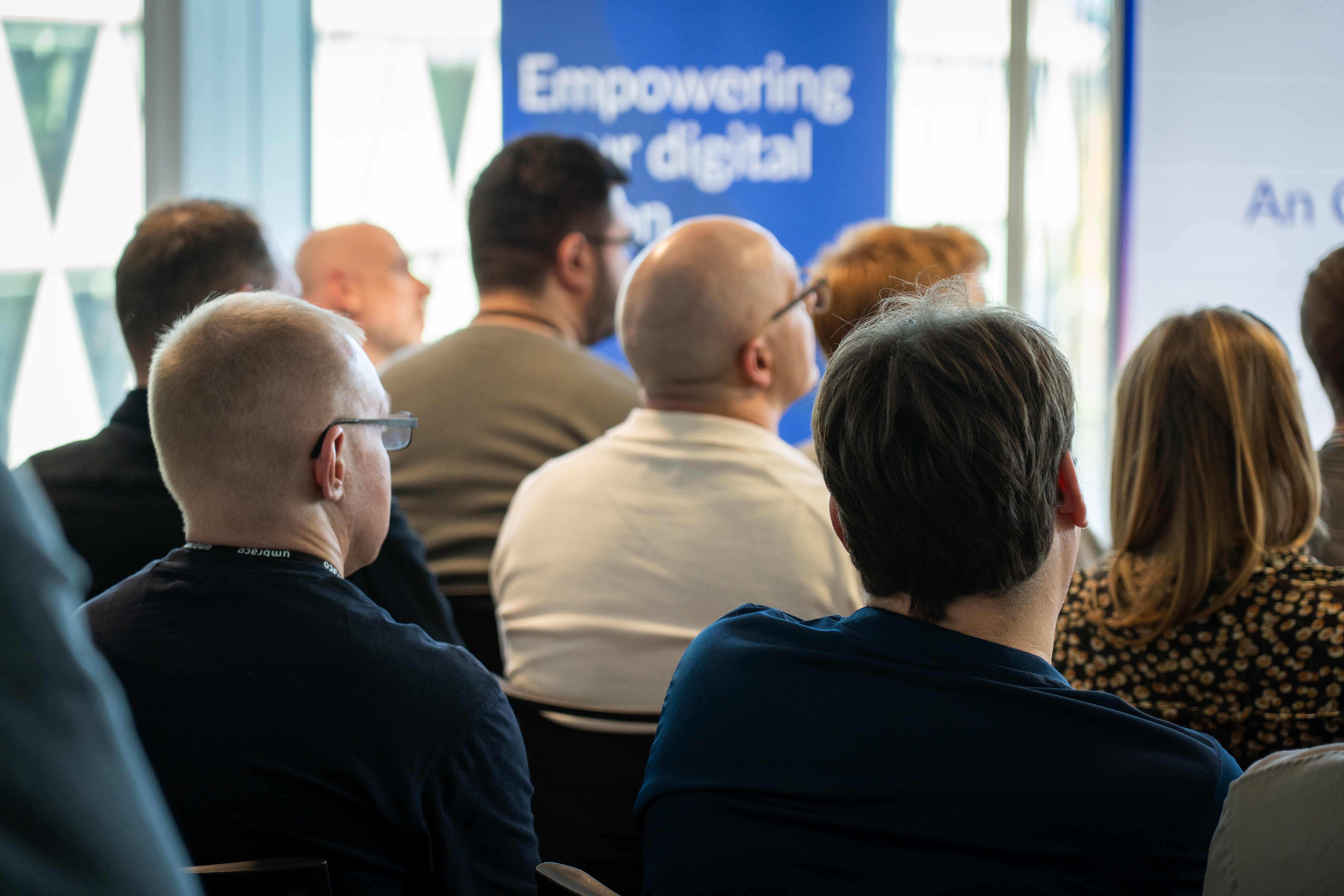 People looking at a conference speaker