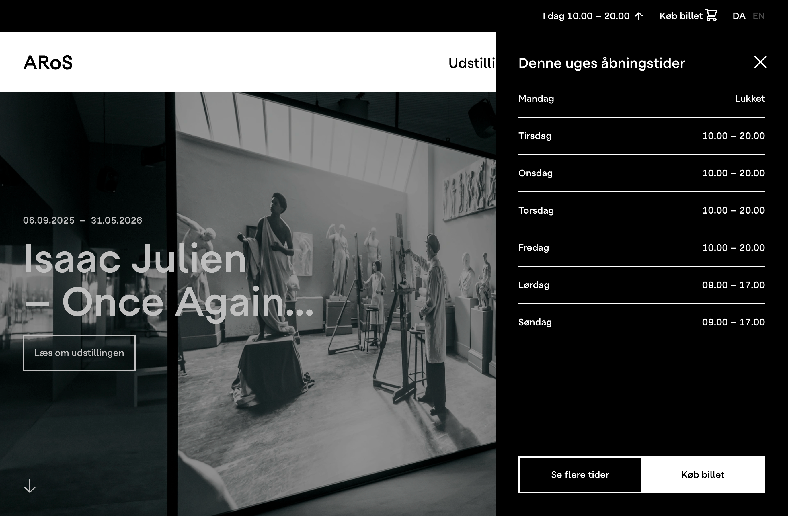 ARoS website with the "Denne uges åbningstider" panel open beside a hero image for the exhibition "Isaac Julien – Once Again…", showing a black-and-white film still of an artist's studio full of classical sculptures.