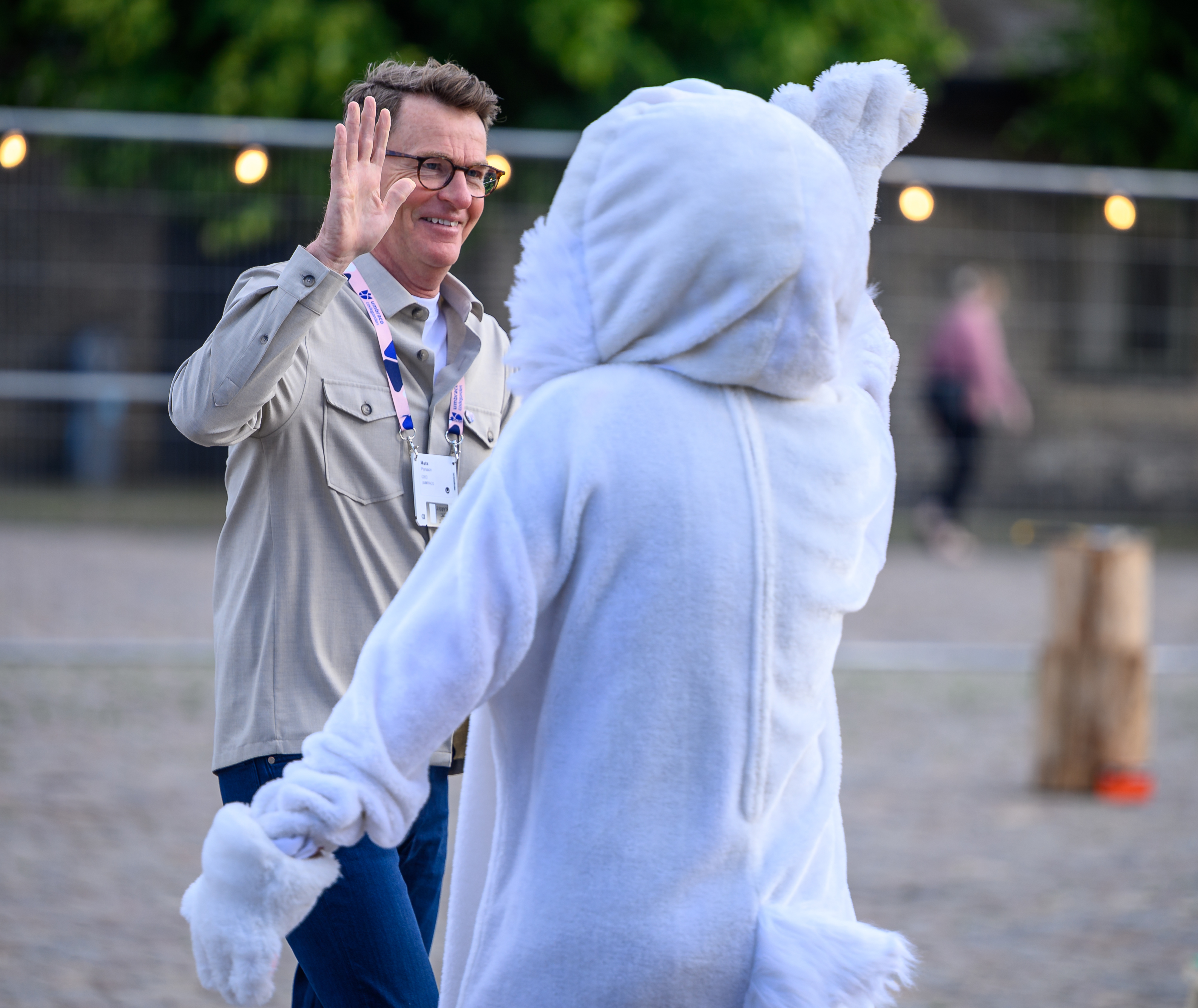 Umbraco CEO Mats Persson high-fives the company mascot, The Rabbit, during Codegarden.
