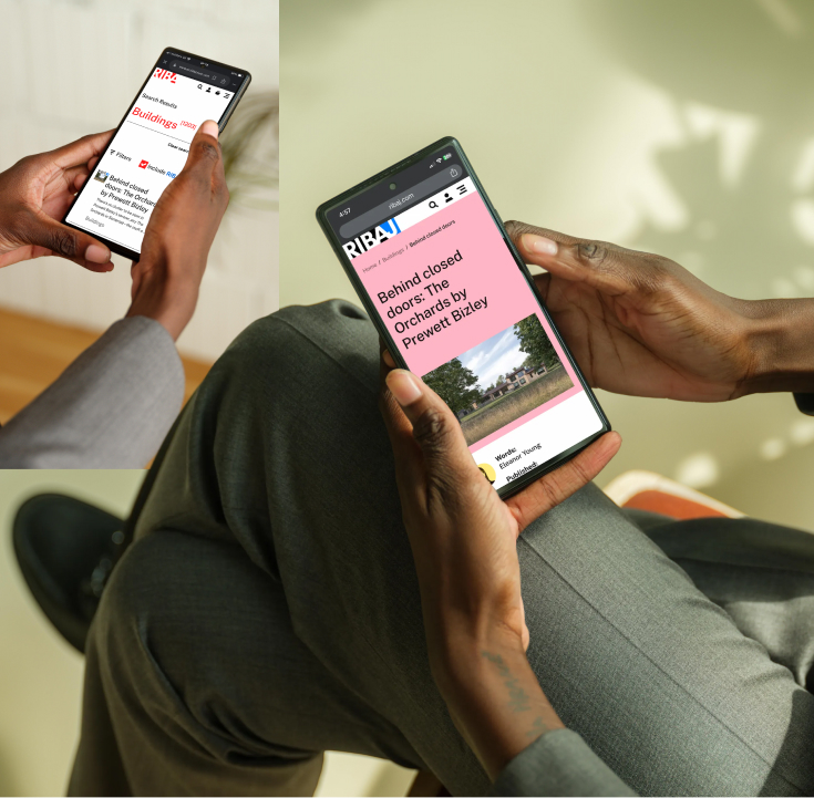 A person holding a smartphone showing an article and a search results page on the RIBA Journal website.