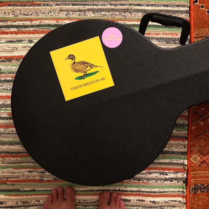 Allen's banjo case with an image of a duck on it.