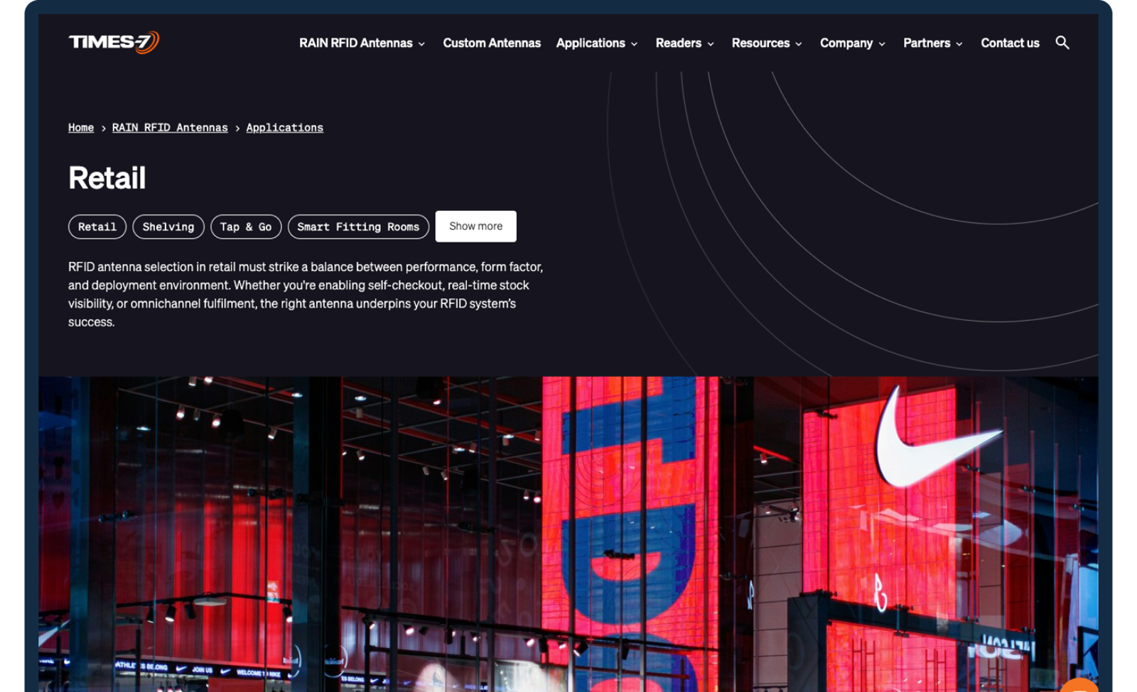 A desktop webpage layout for Times-7 "Retail" applications, featuring descriptive text above a vibrant image of a modern storefront display.