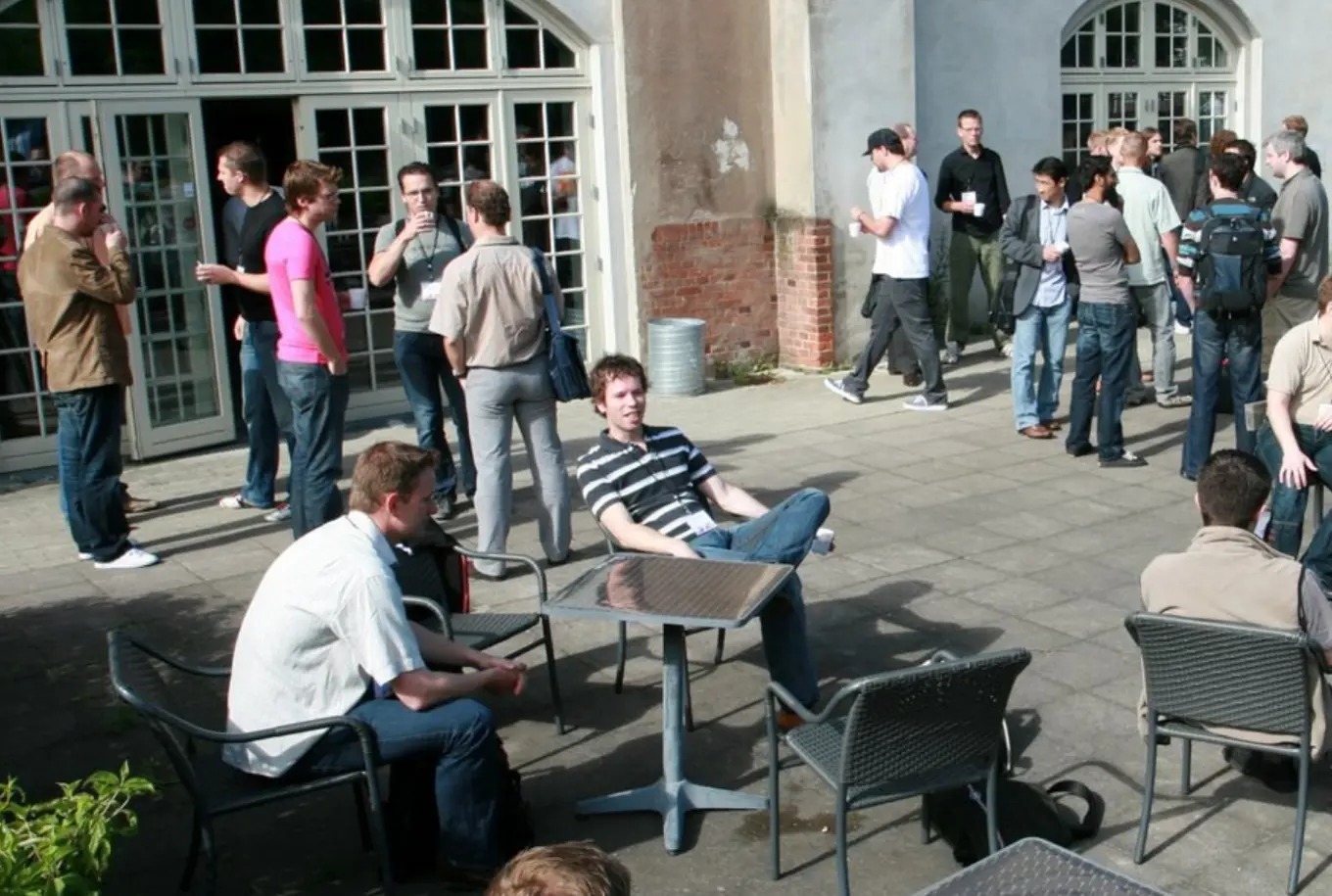 Seb (in the middle with stripey shirt) and Tim (left of him) discussing deployment issues