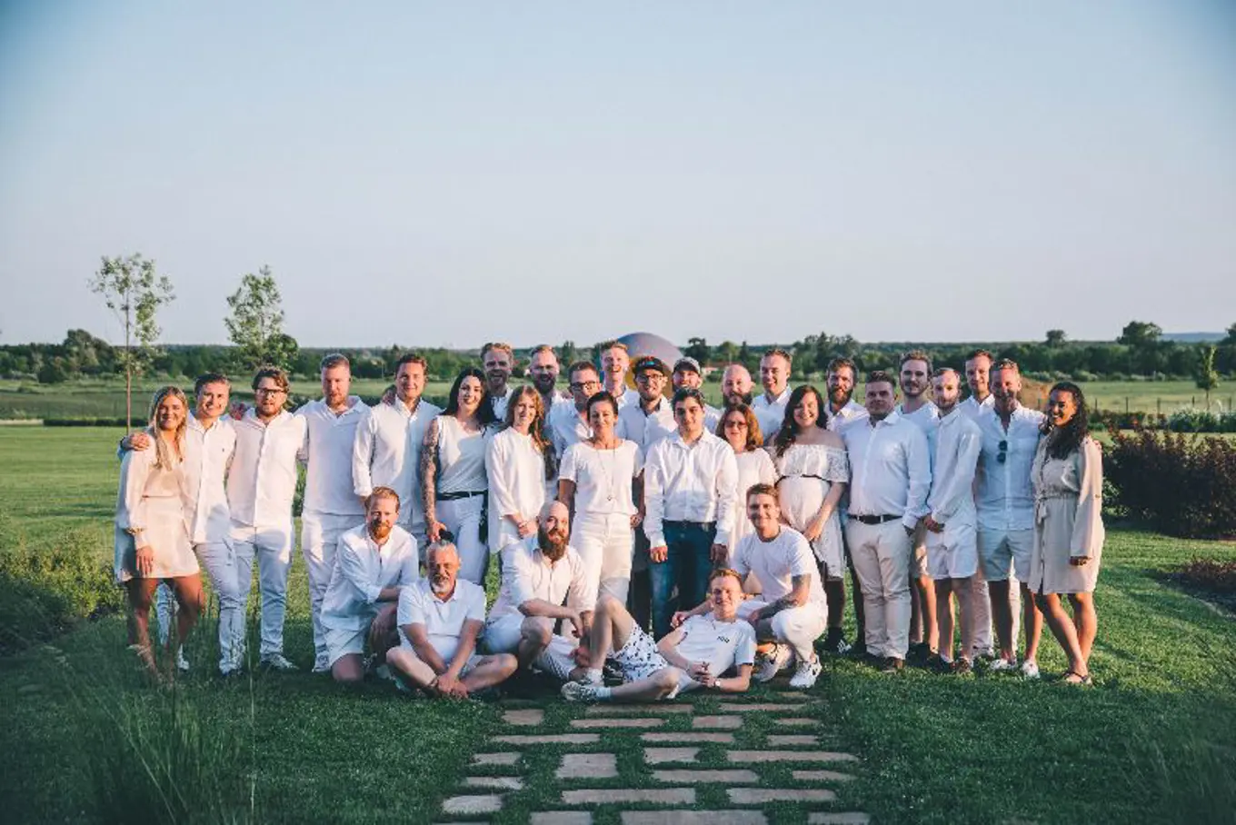 The agency team from Toxic wearing white clothes 